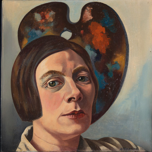kunstschilder Charley Toorop met een schilderspalet achter haar